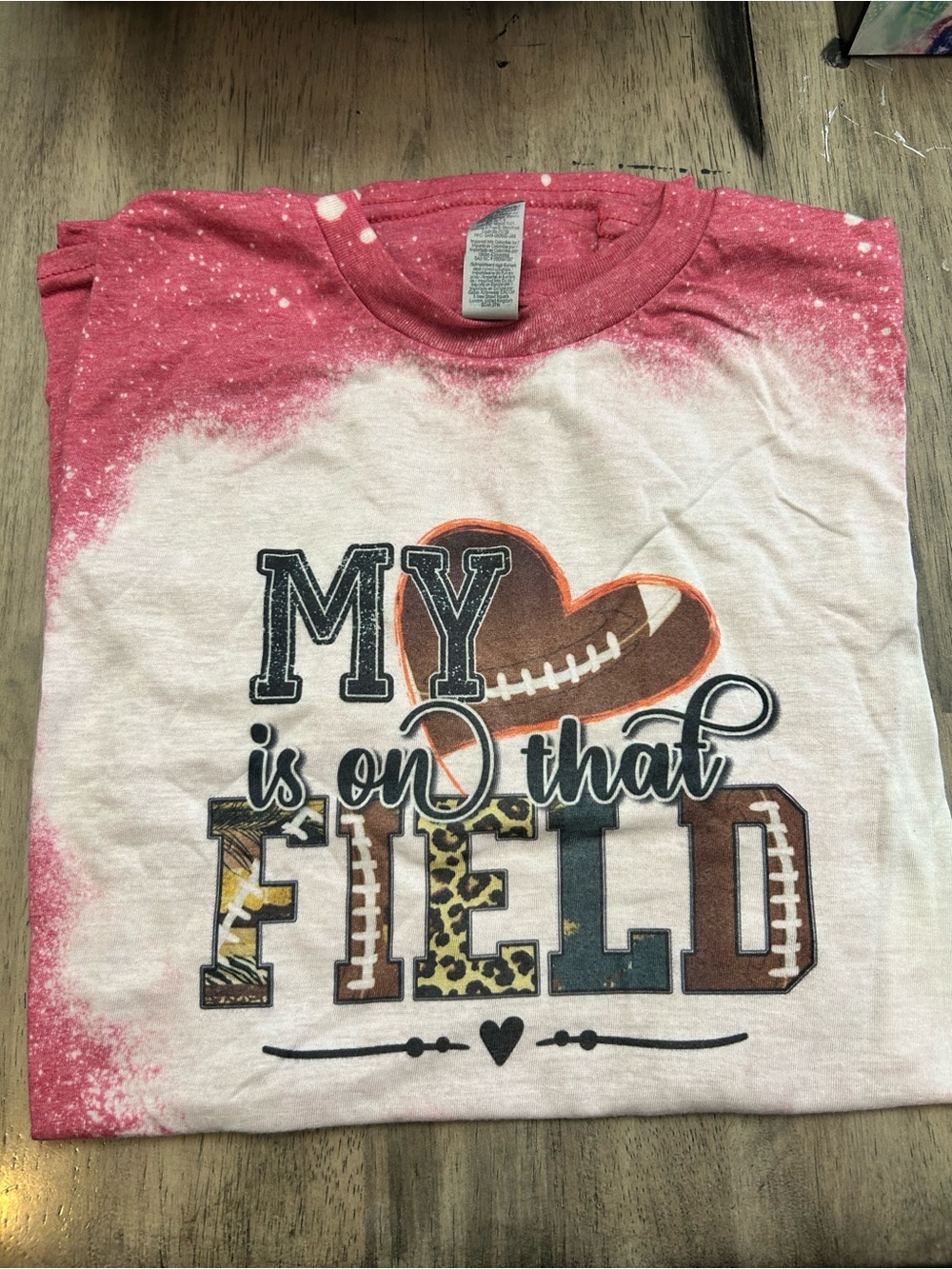 Gildan Pink and White 'My Is On That Field' Football Graphic Tee